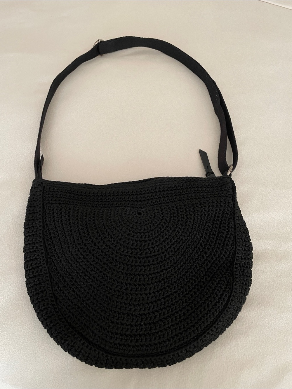 The Sak Black Crochet Half-Moon Crossbody Bag